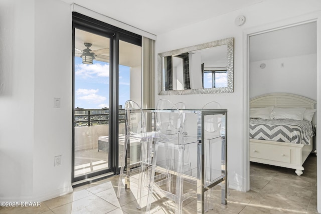 bedroom with access to outside and expansive windows