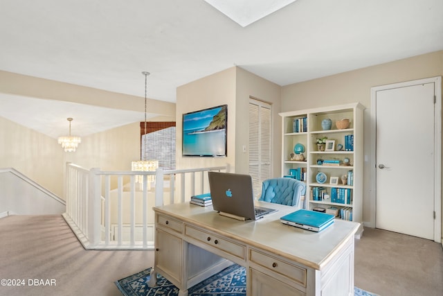 carpeted office with an inviting chandelier