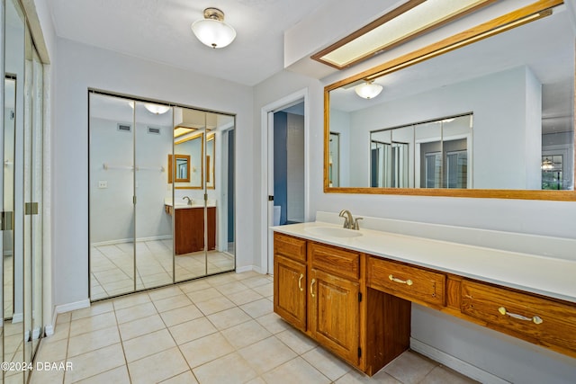 bathroom featuring tile patterned floors and vanity