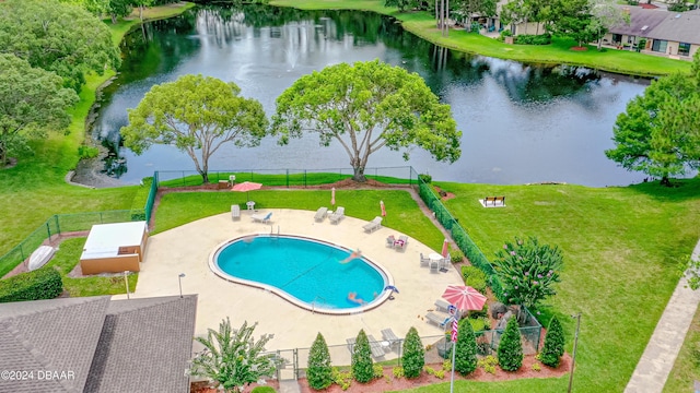 view of swimming pool with a water view and a patio