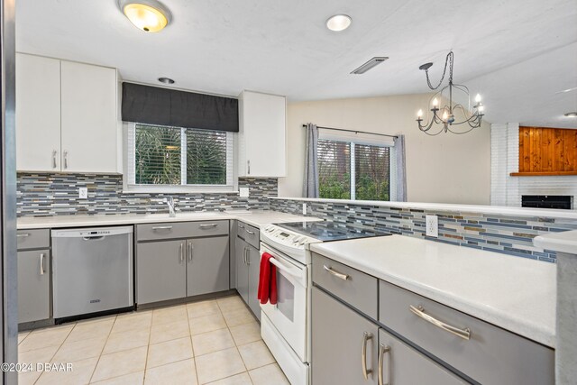 kitchen with stainless steel dishwasher, gray cabinetry, white cabinetry, and white electric stove