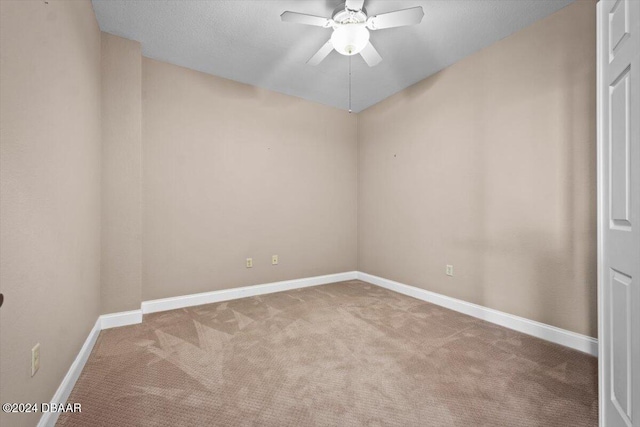 unfurnished room featuring carpet flooring and ceiling fan