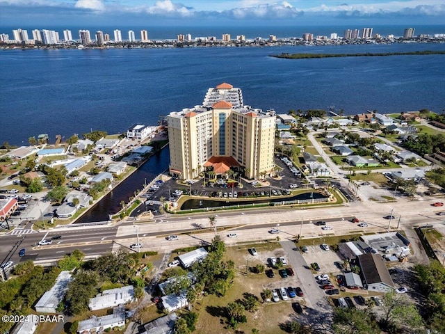 birds eye view of property with a water view