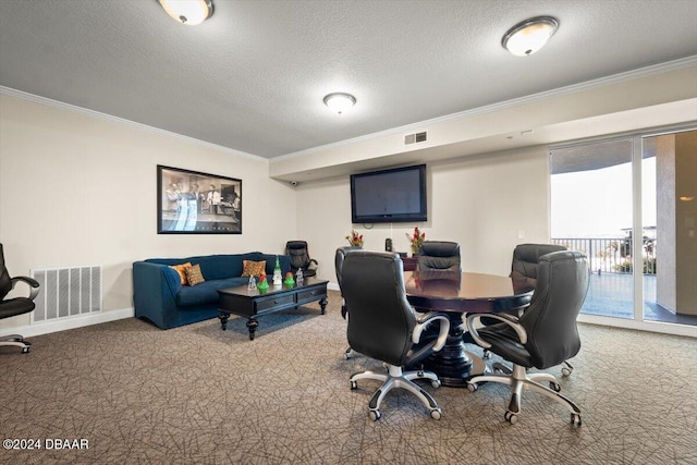 carpeted office space with a textured ceiling and ornamental molding