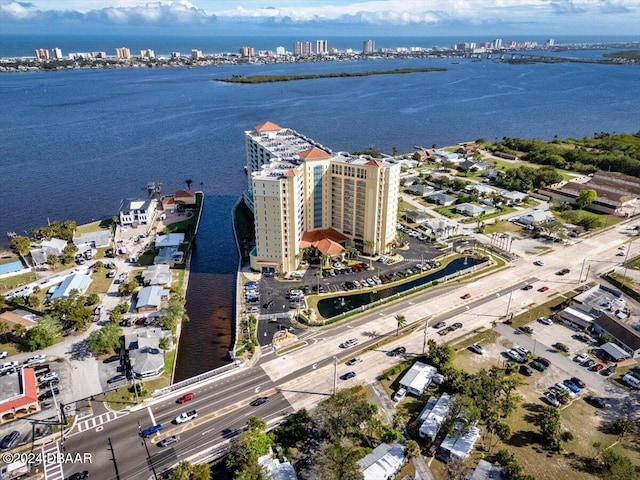 birds eye view of property with a water view