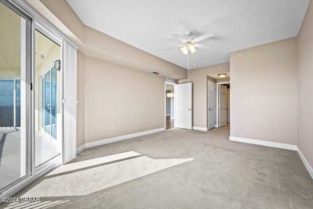 unfurnished bedroom with ceiling fan and light colored carpet