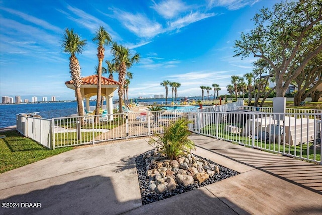 view of patio with a water view