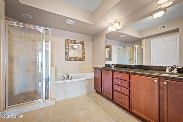 bathroom with vanity, tile patterned floors, and independent shower and bath