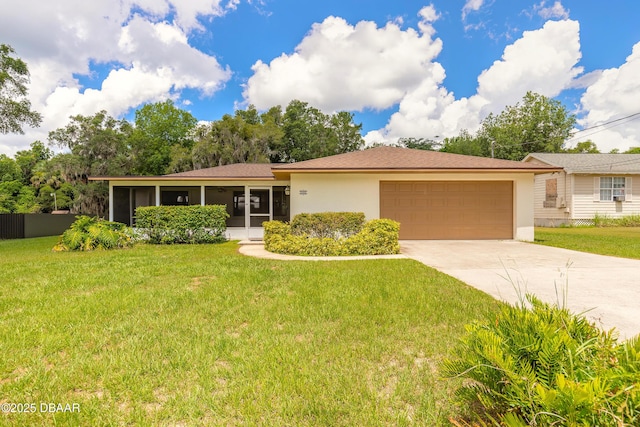 5060 Audubon Ave, Deleon Springs, FL 32130 - single story home featuring a garage, driveway, stucco siding, and a sunroom