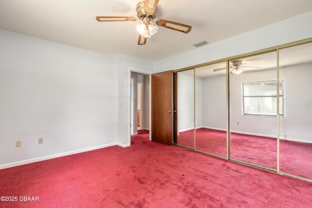 5060 Audubon Ave, Deleon Springs, FL 32130 - unfurnished bedroom with carpet flooring, a textured ceiling, ceiling fan, and a closet