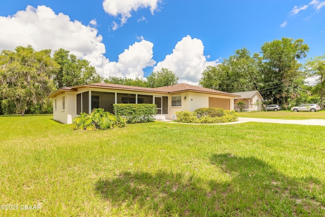 5060 Audubon Ave, Deleon Springs, FL 32130 - single story home with driveway, a garage, stucco siding, and a front yard