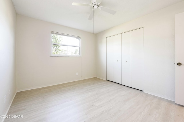 unfurnished bedroom with a closet, ceiling fan, and light hardwood / wood-style flooring