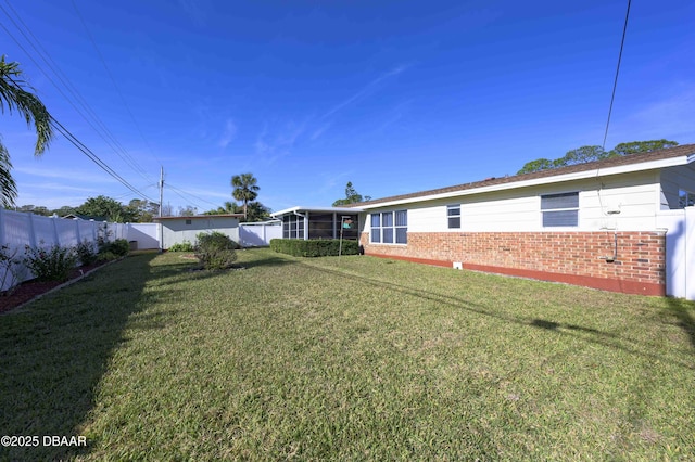 view of yard with a sunroom