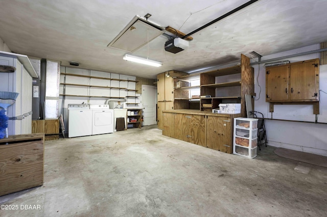 garage featuring a garage door opener and washer and dryer