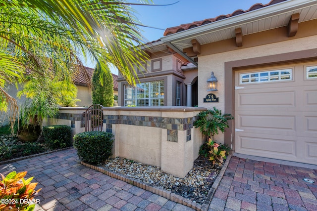 property entrance featuring a garage