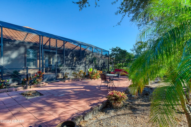 view of patio with a lanai