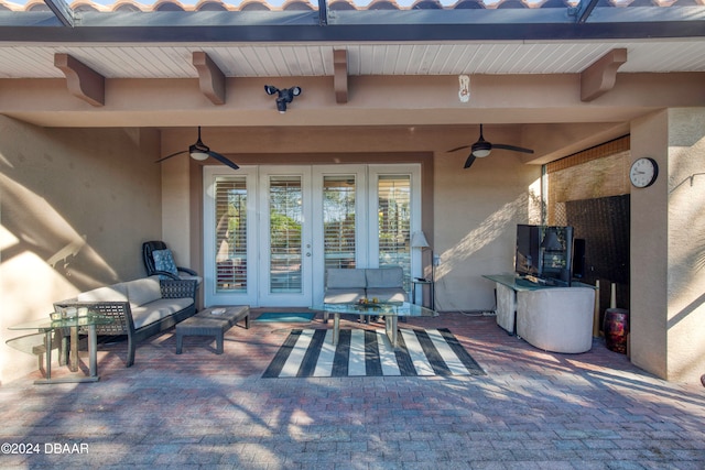 view of patio featuring an outdoor living space and ceiling fan