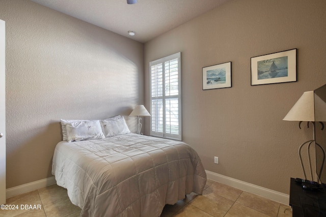 bedroom featuring light tile patterned floors