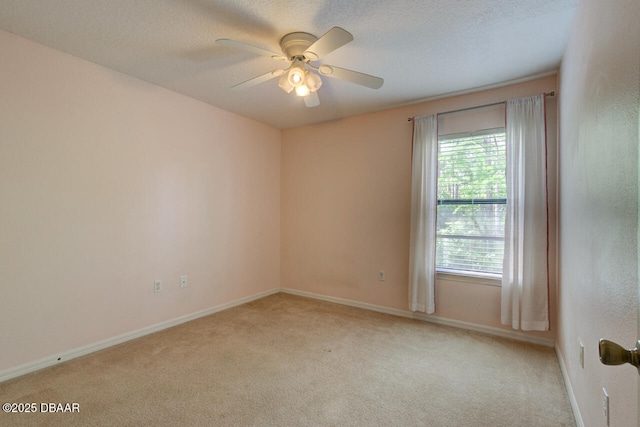 209 Tarracina Way, Daytona Beach, FL 32117 - spare room featuring baseboards, ceiling fan, a textured ceiling, and light colored carpet