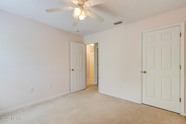 209 Tarracina Way, Daytona Beach, FL 32117 - unfurnished bedroom featuring baseboards, visible vents, ceiling fan, and light colored carpet