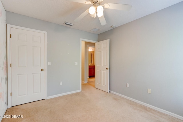 209 Tarracina Way, Daytona Beach, FL 32117 - unfurnished bedroom featuring visible vents, baseboards, ceiling fan, and light colored carpet