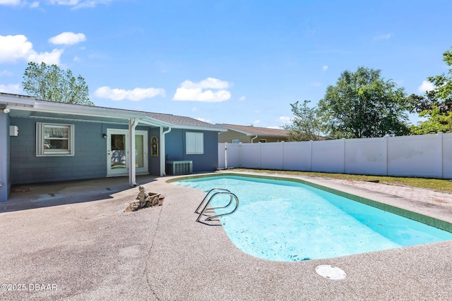 view of pool with a fenced backyard, a fenced in pool, central AC, and a patio