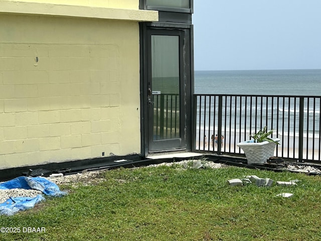 1909 S Atlantic Ave Unit 213, Daytona Beach, FL 32118 - property entrance with a balcony, a water view, and concrete block siding