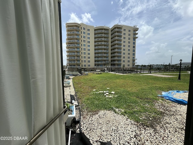 1909 S Atlantic Ave Unit 213, Daytona Beach, FL 32118 - view of home's community featuring a yard
