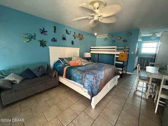 tiled bedroom with ceiling fan