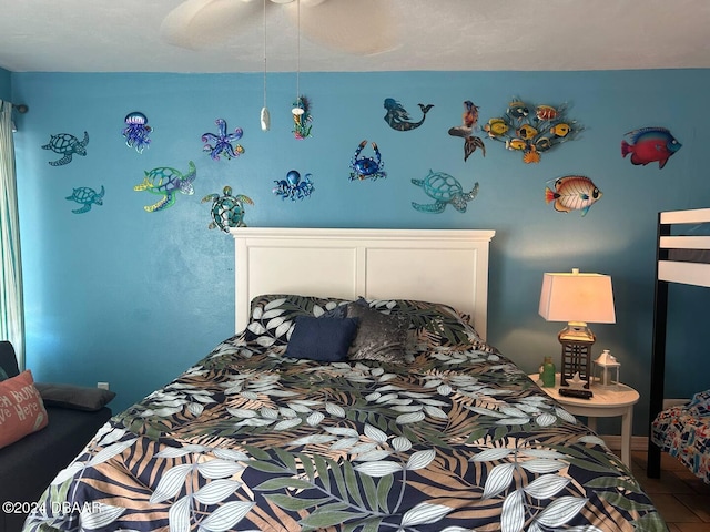 tiled bedroom with ceiling fan