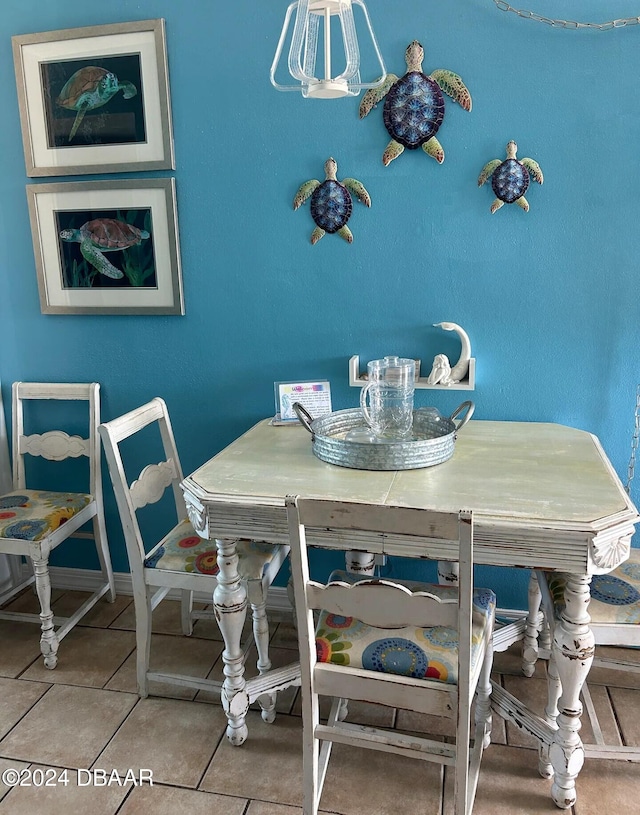 dining space featuring light tile patterned flooring