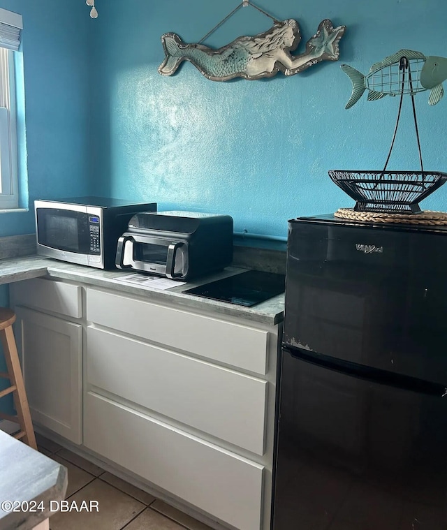 office area with light tile patterned floors