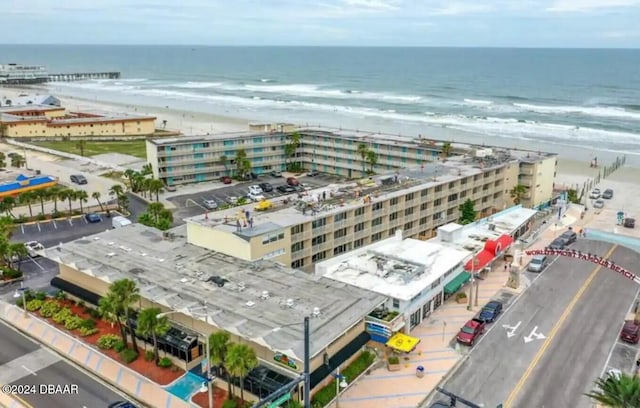 birds eye view of property featuring a view of the beach and a water view