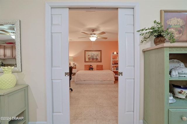 bedroom featuring ceiling fan and light tile patterned floors