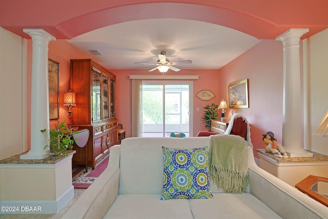 living room with decorative columns and ceiling fan