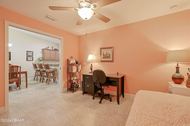 office area with vaulted ceiling and ceiling fan