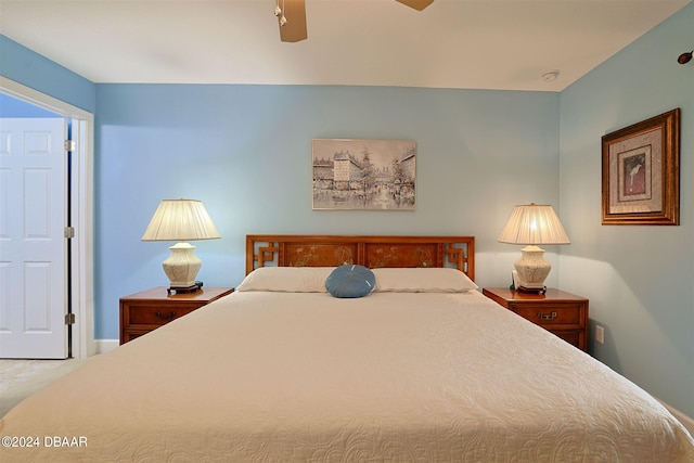 carpeted bedroom featuring ceiling fan