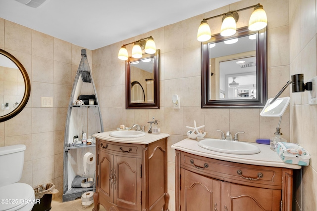 2947 S Atlantic Ave Unit 601, Daytona Beach, FL 32118 - full bathroom with tile walls, two vanities, and backsplash