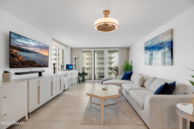 2947 S Atlantic Ave Unit 601, Daytona Beach, FL 32118 - living room with a wall of windows and light tile patterned floors