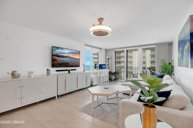 2947 S Atlantic Ave Unit 601, Daytona Beach, FL 32118 - living room featuring a wall of windows and light tile patterned floors