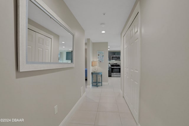 corridor with light tile patterned floors