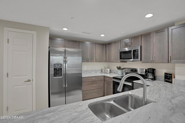 3721 S Atlantic Ave Unit 207, Daytona Beach Shores, FL 32118 - kitchen with stainless steel appliances, light stone counters, and recessed lighting