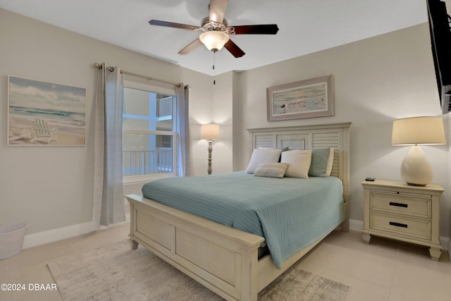 tiled bedroom with ceiling fan