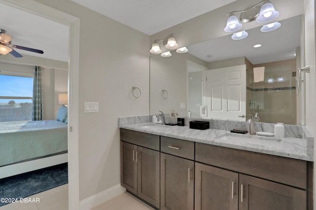 bathroom with ceiling fan, vanity, tile patterned floors, and a shower with shower door