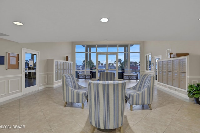 3721 S Atlantic Ave Unit 207, Daytona Beach Shores, FL 32118 - dining space featuring light tile patterned flooring, recessed lighting, a wainscoted wall, french doors, and a decorative wall