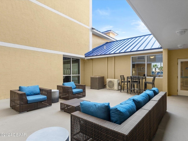 view of patio / terrace featuring central AC unit, ac unit, and an outdoor living space