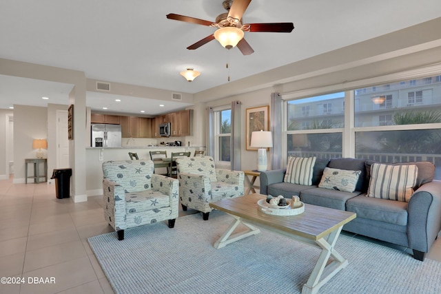 3721 S Atlantic Ave Unit 207, Daytona Beach Shores, FL 32118 - living area featuring a ceiling fan and light tile patterned floors