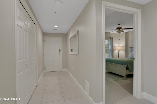 3721 S Atlantic Ave Unit 207, Daytona Beach Shores, FL 32118 - hallway with light tile patterned floors and recessed lighting