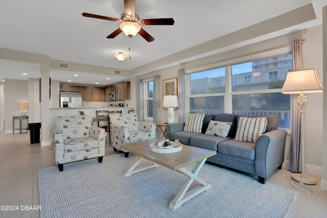 tiled living room featuring ceiling fan