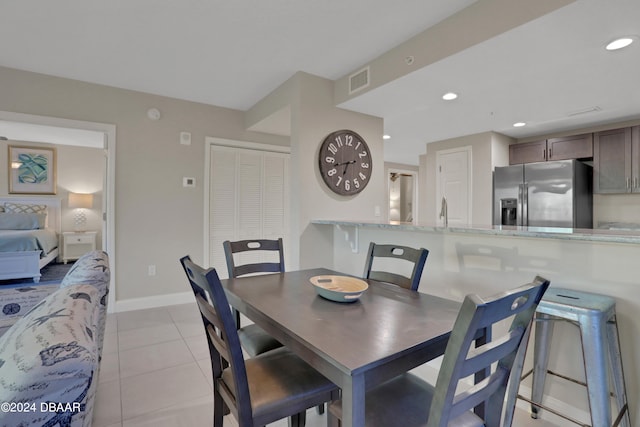 tiled dining space with sink